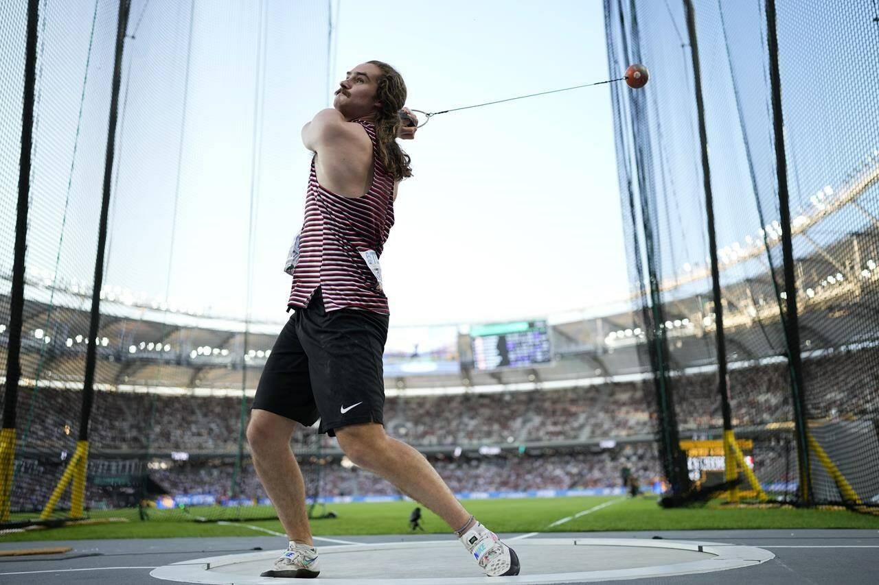 Ethan Katzberg, of Canada, makes an attempt in the Men’s hammer throw final during the World Athletics Championships in Budapest, Hungary, Sunday, Aug. 20, 2023. THE CANADIAN PRESS/AP-Bernat Armangue