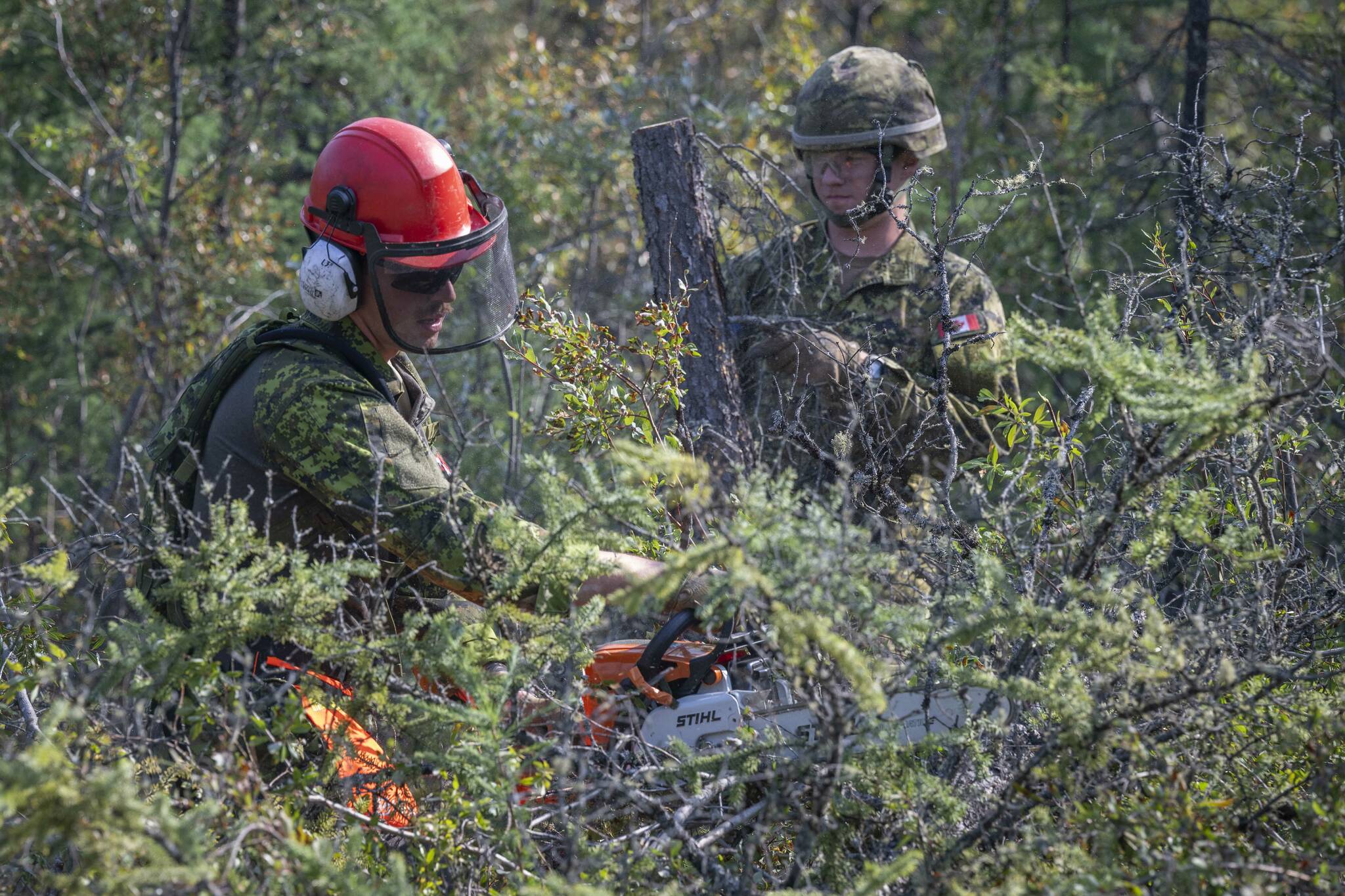 Canadian Armed Forces soldiers construct a firebreak in Parker Recreation Field in Yellowknife to help fight wildfires on Wednesday, Aug.16, 2023. THE CANADIAN PRESS/HO-Canadian Armed Forces-Master Cpl. Alana Morin