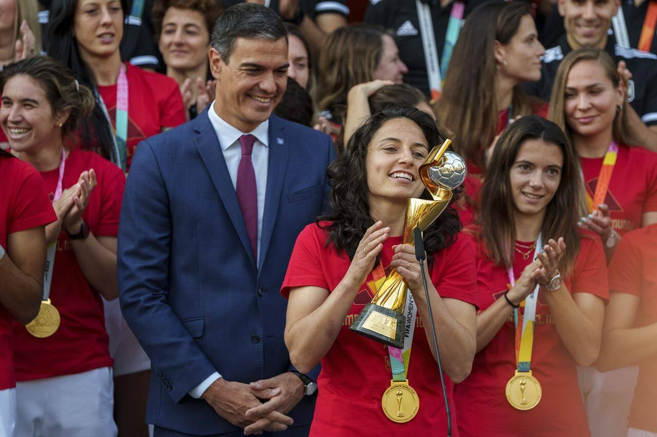 Spain’s acting Prime Minister Pedro Sanchez stands with Spain’s Women’s World Cup soccer team after their World Cup victory, at La Moncloa Palace in Madrid, Spain, Tuesday, Aug. 22, 2023. Spain beat England in Sydney Sunday to win the Women’s World Cup soccer final. (AP Photo/Manu Fernandez)