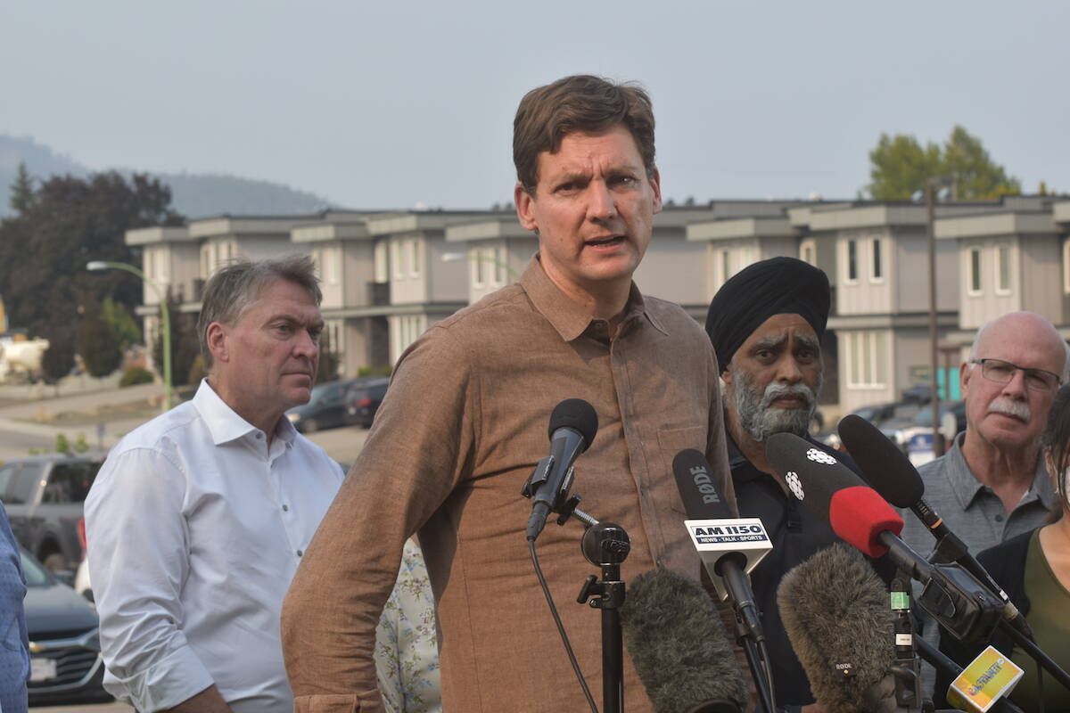 Premier David Eby takes questions from the media during a news conference in West Kelowna on Aug. 22, following a helicopter tour of wildfire devastation in the Central Okanagan. (Gary Barnes/Capital News)