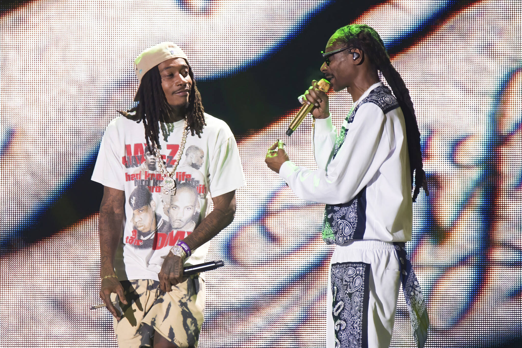 Rappers Wiz Khalifa, left, and Snoop Dogg perform at Hip-Hop 50 Live, celebrating 50 years of hip-hop on Friday, Aug. 11, 2023, at Yankee Stadium in the Bronx borough of New York. (Photo by Scott Roth/Invision/AP)
