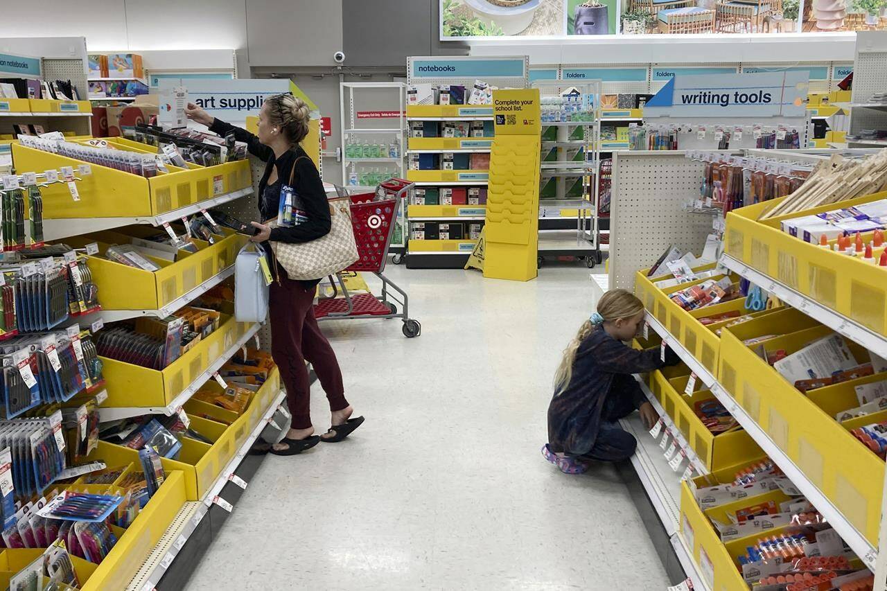 The stationary aisles are expected to be busier this year as parents and students stock up on back-to-school essentials, though their baskets may be a little less full. A parent shops for school supplies deals at a Target store, Wednesday, July 27, 2022, in North Miami, Fla. THE CANADIAN PRESS/AP-Marta Lavandier