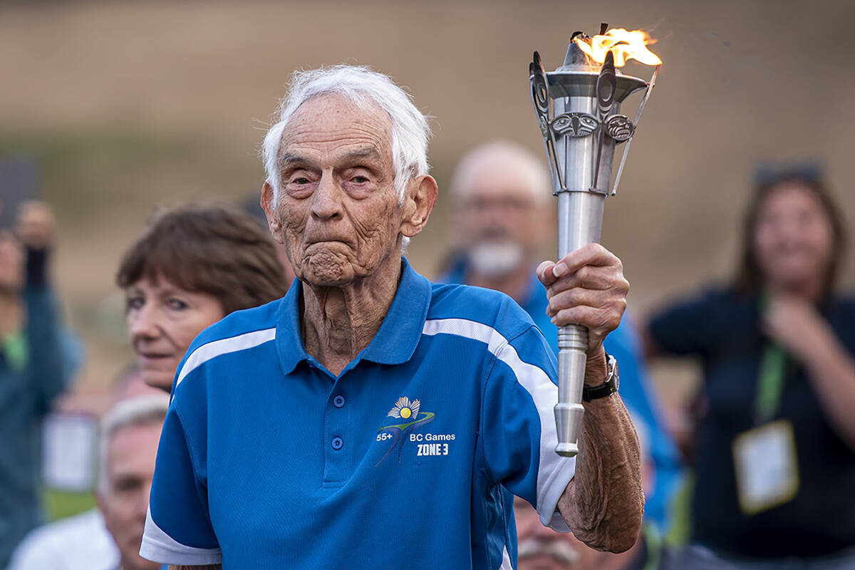 The torch is led into Rotary Stadium. (BC 55-Plus Games photo team)