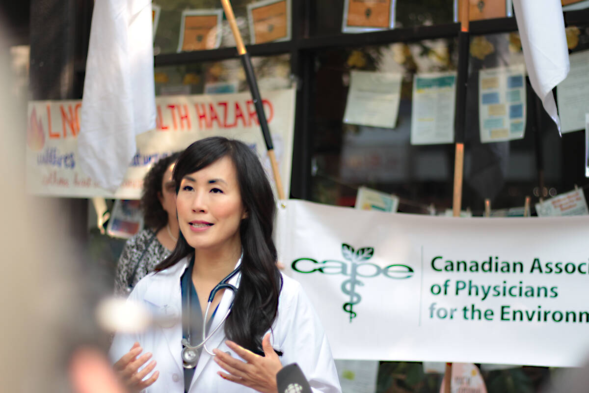 Dr. Melissa Lem, a Vancouver physician and president of the Canadian Association of Physicians for the Environment, speaks outside Premier David Eby’s Vancouver constituency office Thursday (Aug. 24). The association was calling on the province to put a moratorium on future LNG projects, citing the risks associated with climate change. (Lauren Collins)