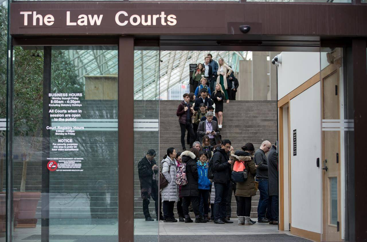 The mother of a 13-year-old girl found dead in a British Columbia park six years ago has told a murder trial how she gave her a last hug, hours before the girl’s death. Members of the media and public line up to enter a courtroom at B.C. Supreme Court, in Vancouver, B.C., Tuesday Jan. 21, 2020. THE CANADIAN PRESS/Darryl Dyck