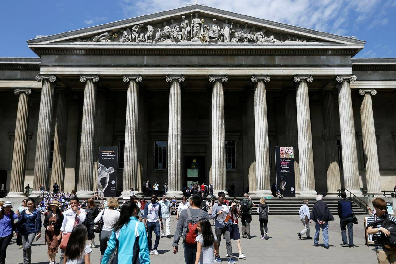 FILE - Visitors walk outside the British Museum in Bloomsbury, London, Friday, June 26, 2015. The British Museum said a member of staff has been dismissed after items were found to be missing, stolen or damaged. The museum said Wednesday, Aug. 16, 2023 it has also ordered an independent review or security and ordered kickstart a ‘’vigorous program to recover the missing items.” (AP Photo/Tim Ireland, File)