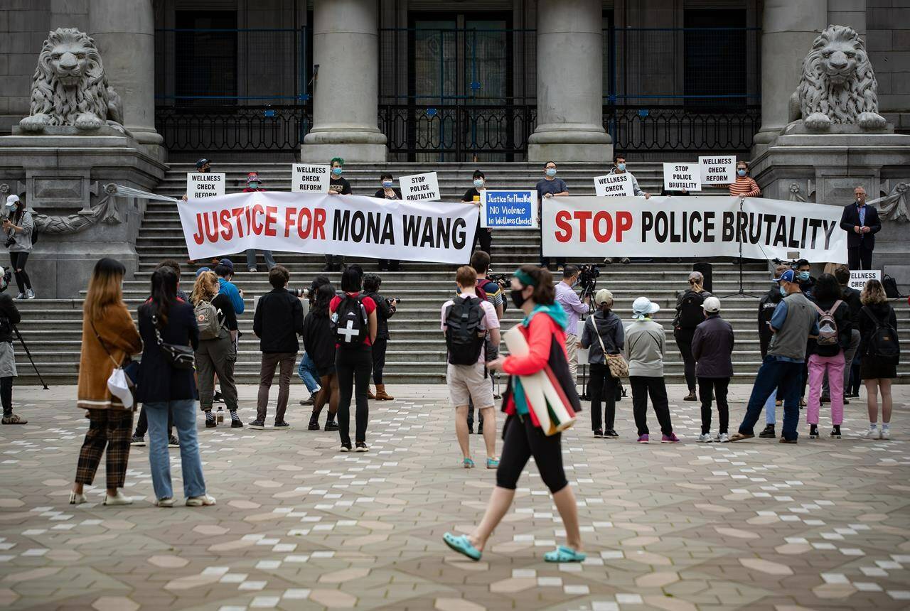 People attend a demonstration in support of nursing student Mona Wang, who alleges excessive force was used by an RCMP officer during a wellness check in Kelowna, in Vancouver, on Saturday, July 11, 2020. The BC Prosecution Service has confirmed a Mountie who pleaded guilty to assault of a University of British Columbia student during a wellness check in Kelowna has received a conditional discharge and was placed on probation for two years. THE CANADIAN PRESS/Darryl Dyck