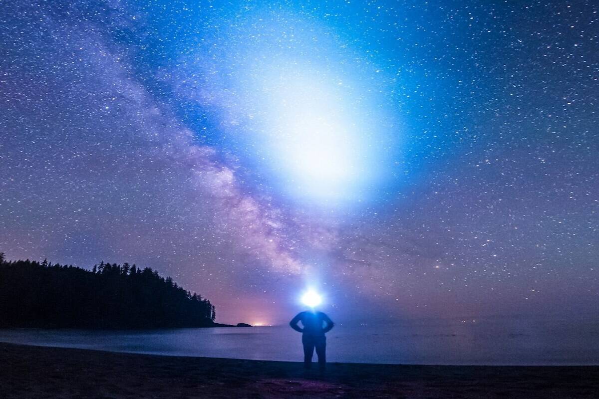 University of Victoria astronomer Spencer Bialek takes in the stars at Sombrio beach. The PhD student is studying how to mitigate the impact that hundreds of thousands of new satellites are expected to have on astronomy observations. (Courtesy of Spencer Bialek)