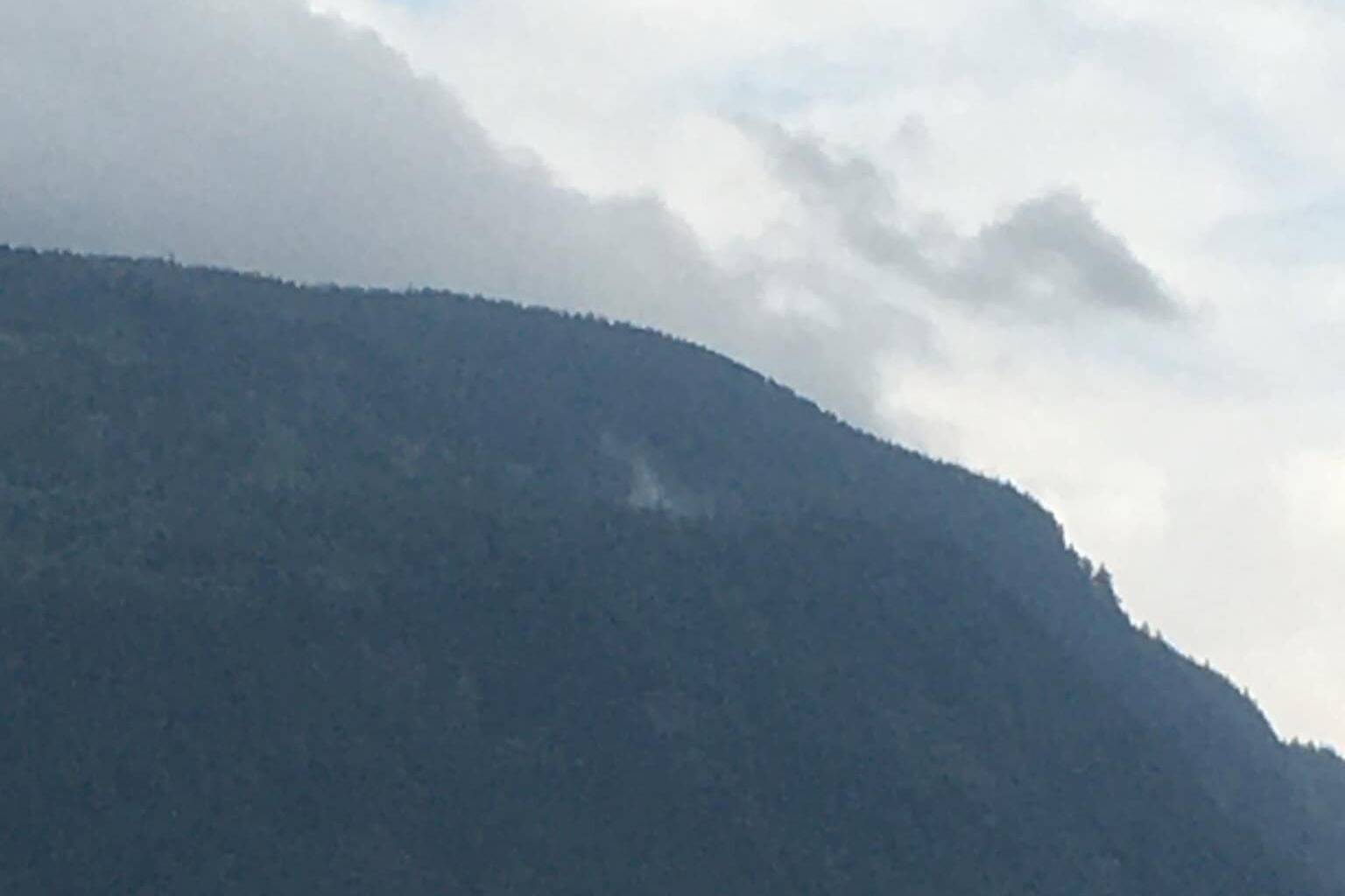 A wisp of smoke comes off of Bear Mountain near Harrison Hot Springs. This was one of a handful of wildfires that started early this week when thunderstorms rolled through the Fraser Valley. While the Bear Mountain fire is out of control, there are no open flames at this time. (Photo/Michelle Sharma)