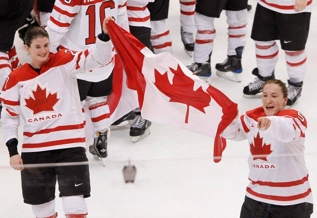 Gina Kingsbury is the general manager of the Professional Women’s Hockey League’s team in Toronto. Kingsbury, left, and Colleen Sostorics celebrate with the flag after winning the gold medal ice hockey game against the United States at the 2010 Olympics in Vancouver, B.C., Thursday, Feb. 25, 2010. THE CANADIAN PRESS/Adrian Wyld