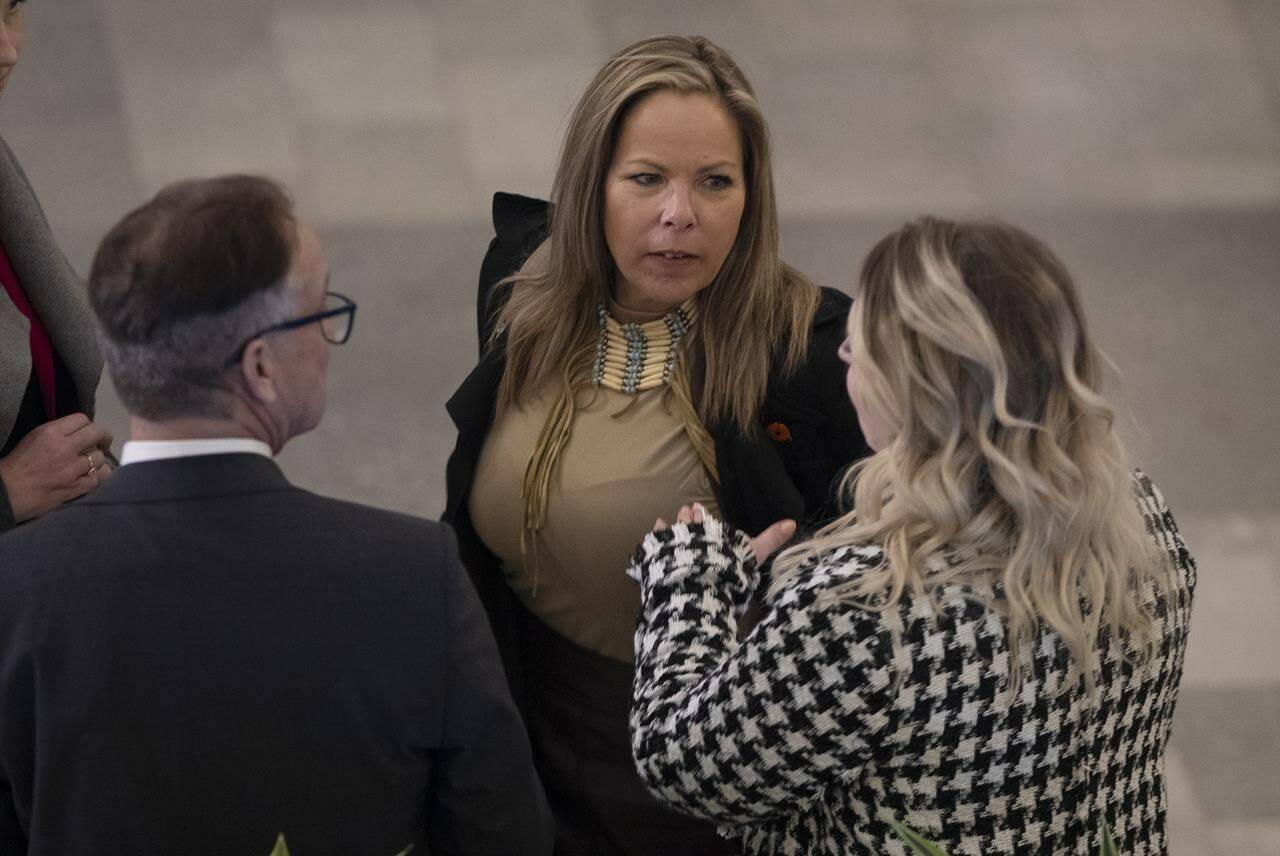 Freedom Convoy organizer Tamara Lich and follow convoy organizer Chris Barber are scheduled to stand trial in Ottawa Tuesday for their role in the Freedom Convoy protest that overtook the streets of Ottawa for weeks and sparked a national emergency. Lich, centre, chats with Drew Barnes MLA Cypress Medicine Hat, left, and others before the 2023 budget, in Edmonton, Tuesday, Feb. 28, 2023. THE CANADIAN PRESS/Jason Franson