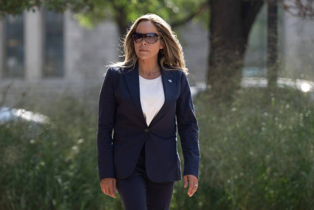 Tamara Lich makes her way back to the courthouse following a brief break on the first day of the trial for "Freedom Convoy" organizers Lich and Chris Barber, Tuesday, September 5, 2023 in Ottawa. THE CANADIAN PRESS/Adrian Wyld