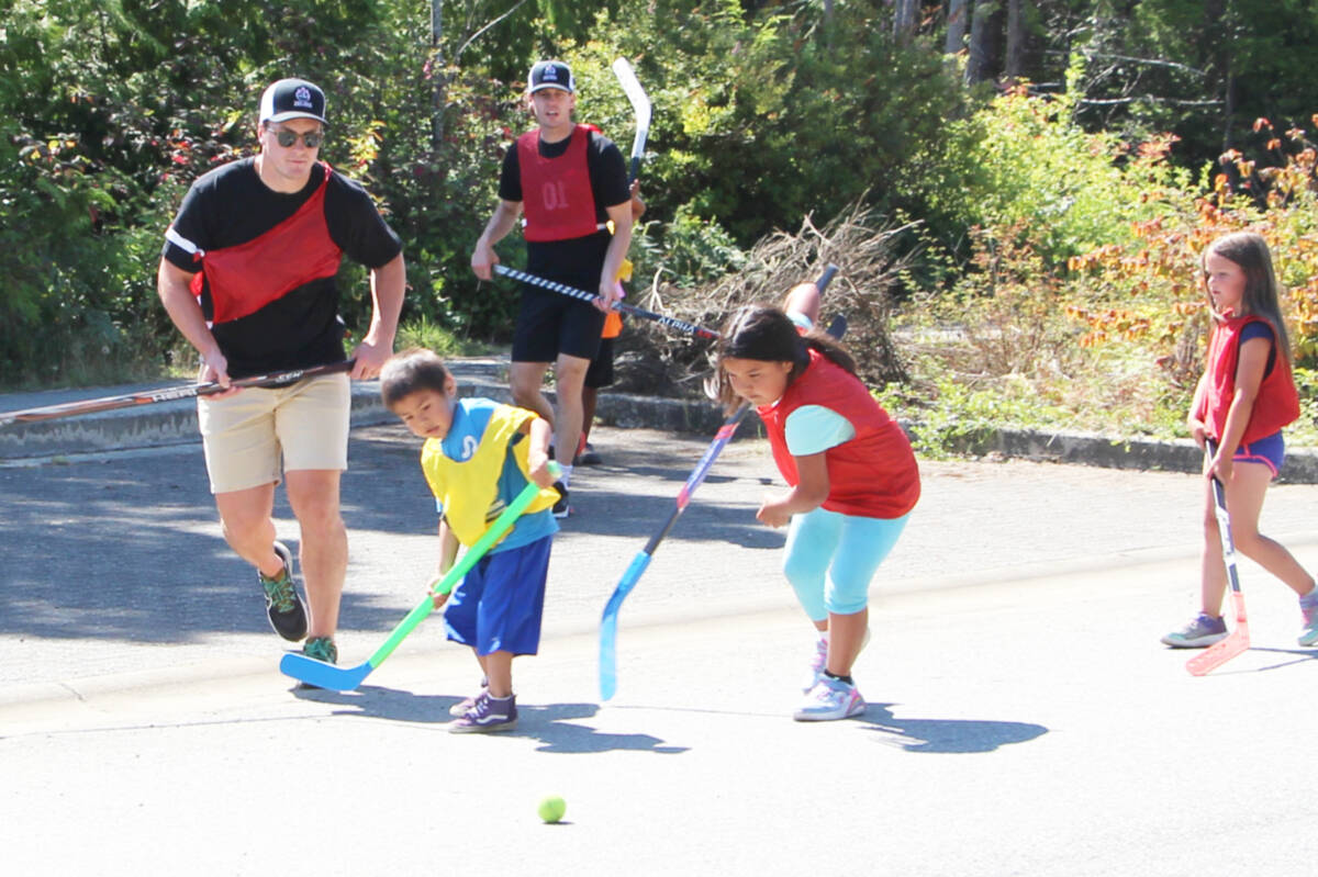 NHL players Tyson Barrie and Tyler Ennis were all smiles as they played ball hockey with local kids in Ty-Histanis on Aug. 17. (Andrew Bailey photo)