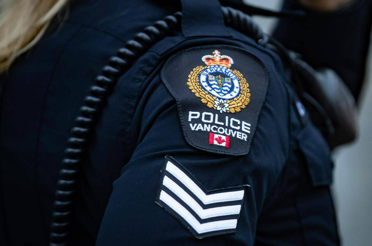 Prosecutors in British Columbia have approved multiple charges against a Vancouver police officer a year after a pedestrian was hit by a police car in the city’s Downtown Eastside. A Vancouver Police Department patch is seen on an officer’s uniform in the Downtown Eastside of Vancouver, B.C., Saturday, Jan. 9, 2021. THE CANADIAN PRESS/Darryl Dyck