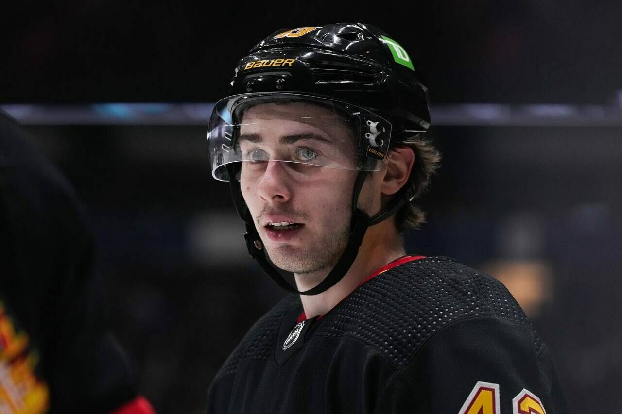 Vancouver Canucks’ Quinn Hughes lines up for a faceoff against the Seattle Kraken during the second period of an NHL hockey game in Vancouver, on Tuesday, April 26, 2022. THE CANADIAN PRESS/Darryl Dyck