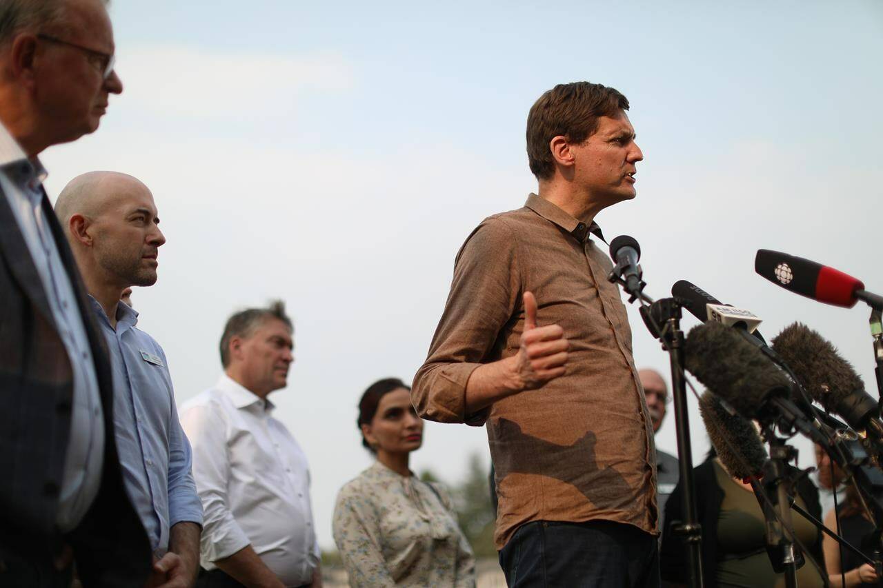 B.C. Premier David Eby and Emergency Management Minister Bowinn Ma are visiting the province’s wildfire-hit southern interior Monday to meet with those affected by this season’s devastating wildfires. Eby, here seen in West Kelowna on Aug. 22, used the occasion of Monday’s visit to announce a task force to deal with climate-related emergencies. (THE CANADIAN PRESS/Chad Hipolito)