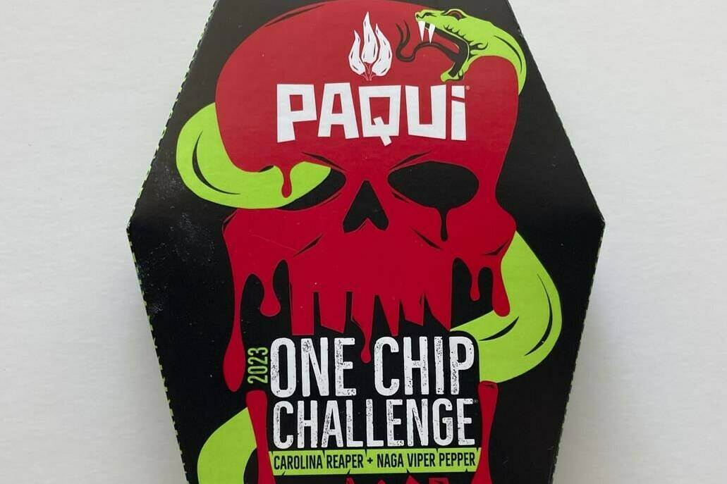 A package of Paqui OneChipChallenge spicy tortilla chips is seen on Thursday, Sept. 7, 2023, in Boston. Authorities are raising the alarm about a OneChipChallenge social media trend that encourages people to avoid seeking relief from eating and drinking for as long as possible after eating the chips, days after a Massachusetts teenager died hours after taking part in the challenge. The dare is popular on social media sites, with scores of people including children unwrapping the packaging, eating the chips and reacting to the heat. (AP Photo/Steve LeBlanc)