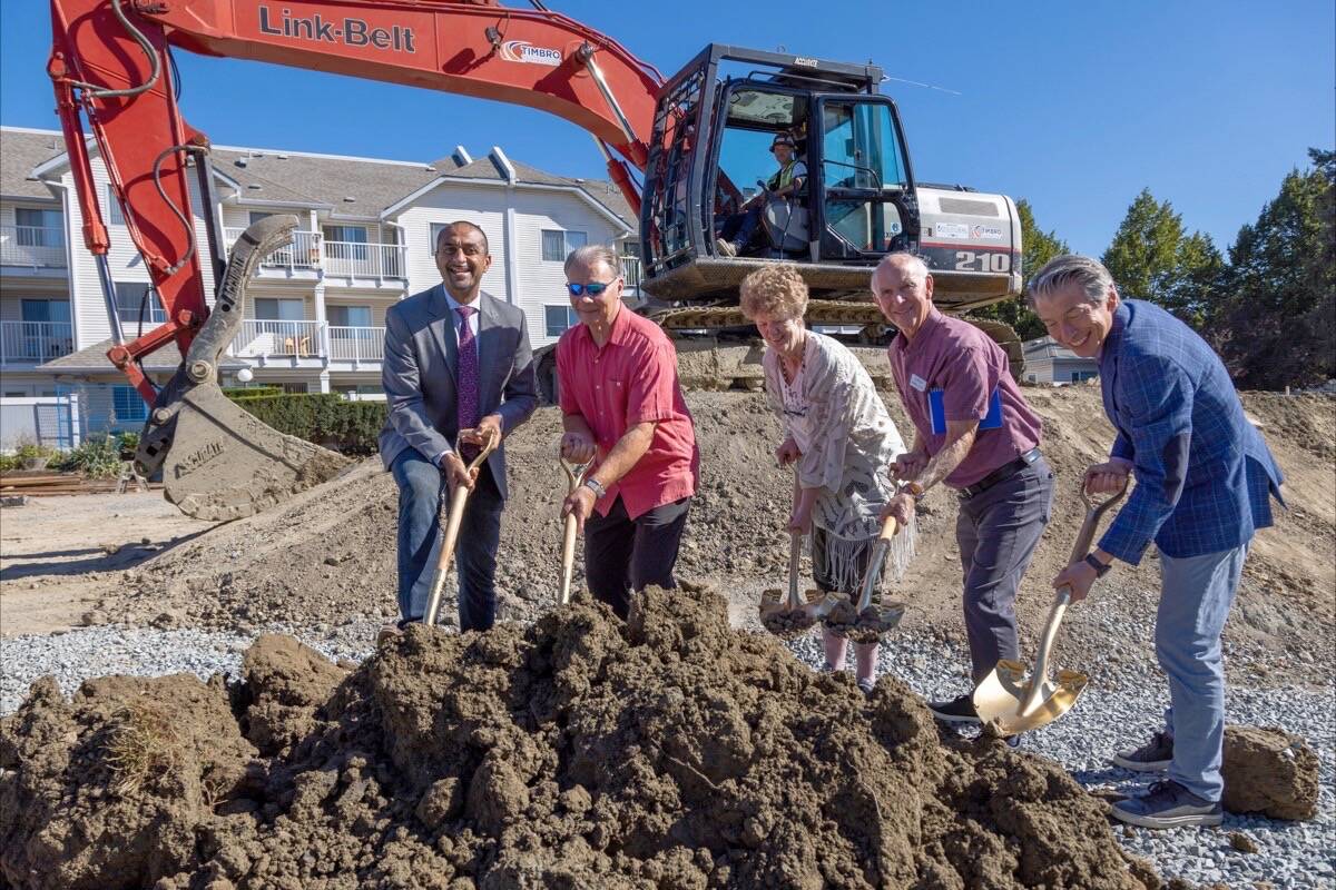 Housing Minister Ravi Kahlon (left), here seen at the August groundbreaking for a new 152-unit housing development in Tsawwassen with Delta Mayor George Harvie, KinVillage resident Pat Marsh, KinVillage board chair Dennis Deslauriers and KinVillage Association CEO Dan Levitt, welcomes the federal government’s decision to rebate the GST on new rental constructions. (Province of British Columbia/Flickr photo)