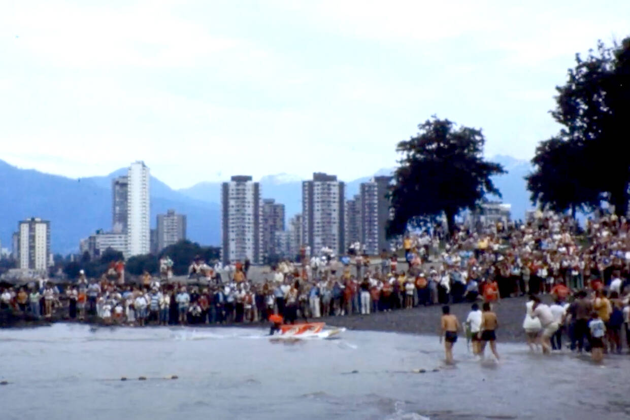 Spectators fill a Vancouver shoreline to watch competitors in the bathtub races from Nanaimo in 1971. (Reel Life still)