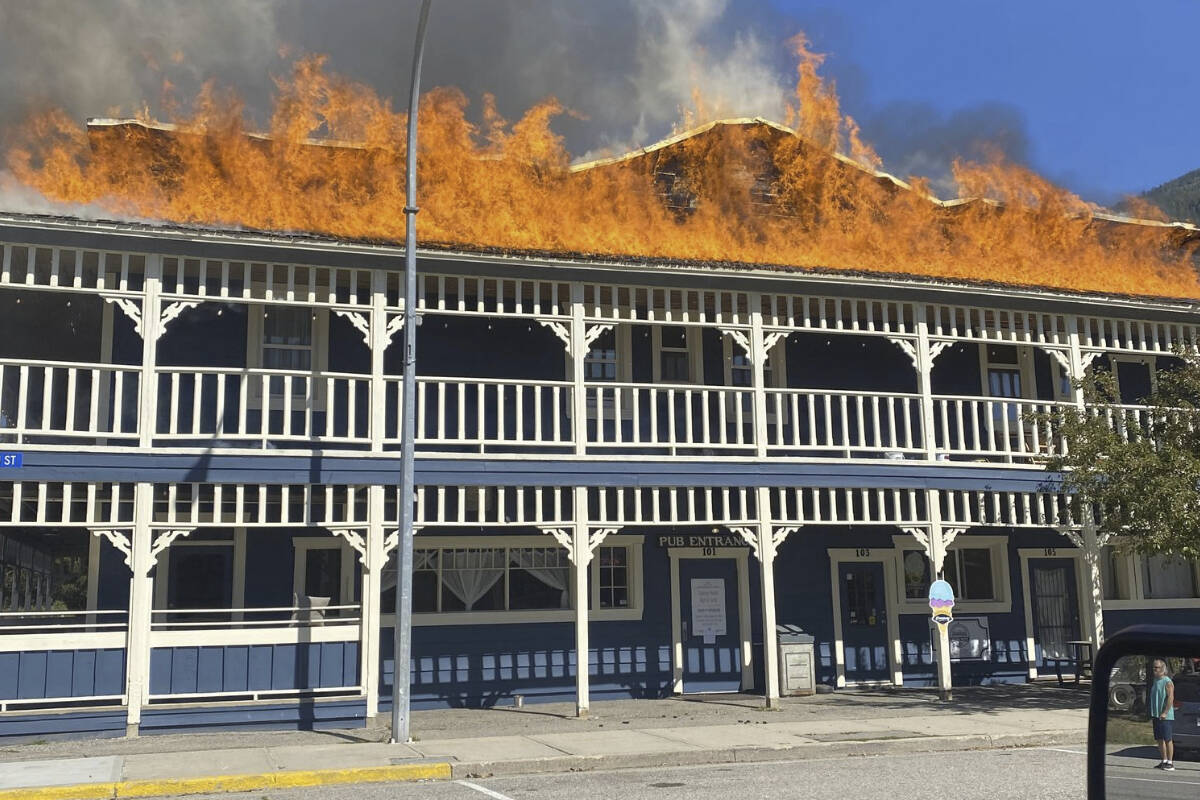 The roof of the Salmo Hotel caught fire Friday afternoon. Salmo RCMP say the fire is now out and no one was injured, although the building has sustained significant damage. Photo: Submitted