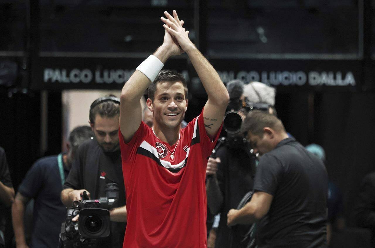 Canada’s Alexis Galarneau celebrates after defeating Chile’s Alejandro Tabilo during the men’s single Davis Cup group A tennis match between Chile and Canada, in Bologna, Saturday Sept. 16, 2023. (Michele Nucci/LaPresse via AP)