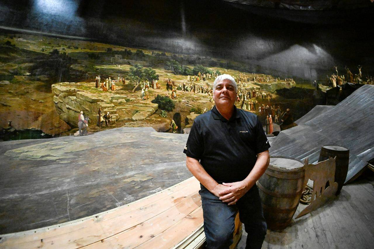 Pierre Blouin sits inside the Cyclorama de Jerusalem, in Ste-Anne-de-Beaupré, Que., on Wednesday, Sept. 6, 2023. The last cyclorama in Canada has been hidden from public view since it shuttered in 2018, but a small group of people are hoping to revive the once popular attraction. THE CANADIAN PRESS/Jacques Boissinot