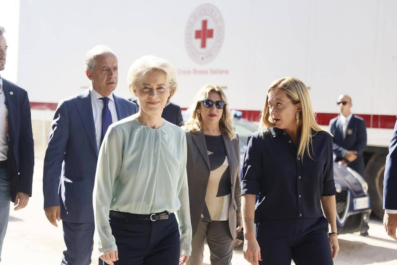 The President of the European Commission, Ursula von der Leyen, front left, and the Italy’s Premier Giorgia Meloni, front right, visit the island of Lampedusa, in Italy, Sunday, Sept. 17, 2023. EU Commission President Ursula von der Leyen and Italian Premier Giorgia Meloni on Sunday toured a migrant center on Italy’s southernmost island of Lampedusa that was overwhelmed with nearly 7,000 arrivals in a 24-hour period this week. (Cecilia Fabiano/LaPresse via AP)