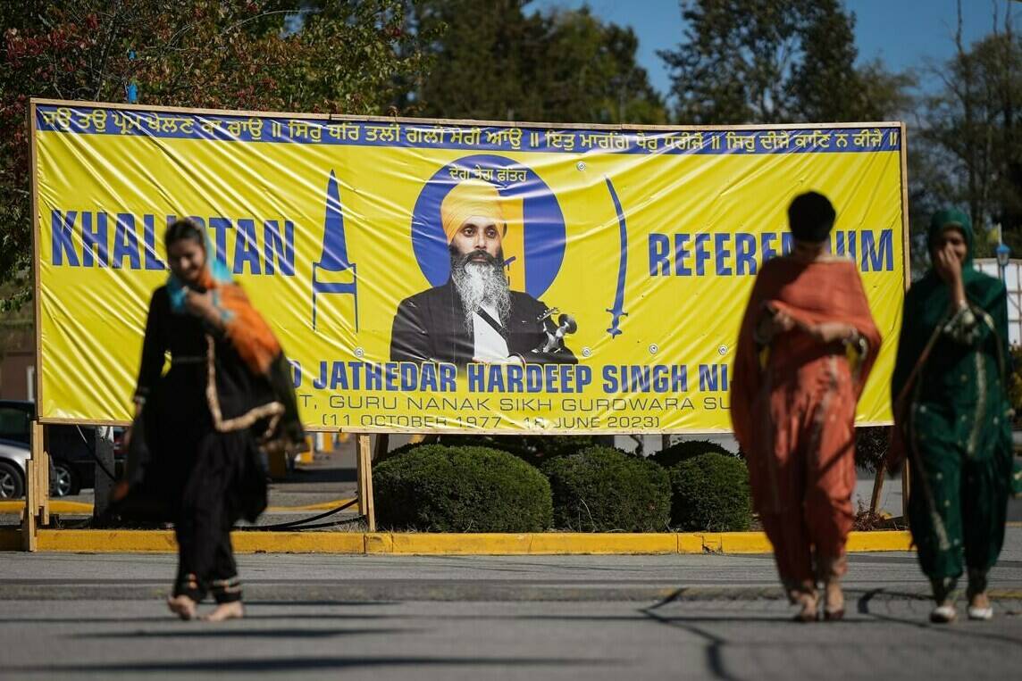 A photograph of late temple president Hardeep Singh Nijjar is seen on a banner outside the Guru Nanak Sikh Gurdwara, in Surrey, B.C., on Monday, Sept. 18, 2023. Prime Minister Justin Trudeau says Canadian intelligence services are investigating “credible” information about “a potential link” between the government of India and the murder of Nijjar. THE CANADIAN PRESS/Darryl Dyck