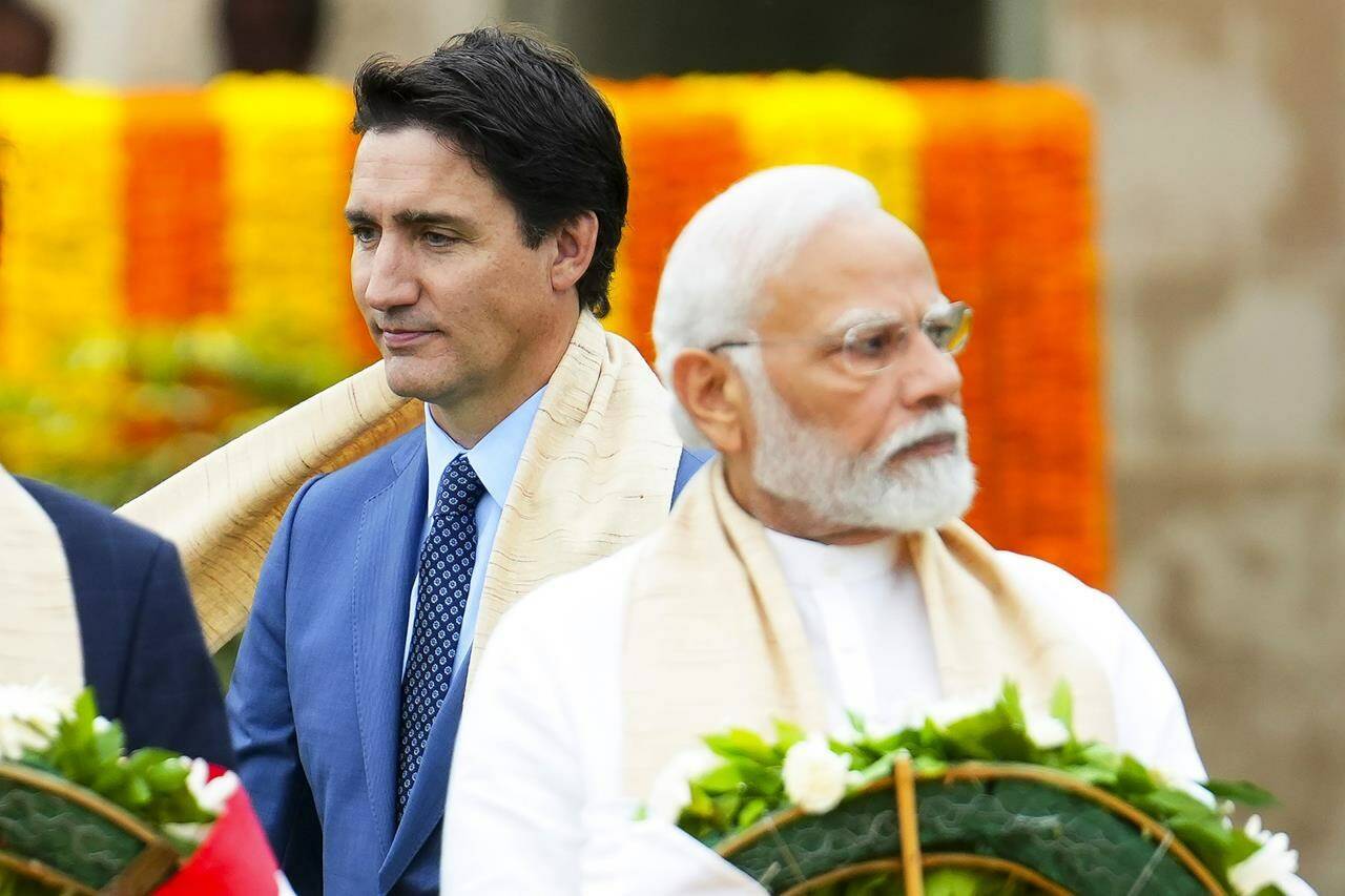 FILE - Canada’s Prime Minister Justin Trudeau, left, walks past Indian Prime Minister Narendra Modi as they take part in a wreath-laying ceremony at Raj Ghat, Mahatma Gandhi’s cremation site, during the G20 Summit in New Delhi, Sunday, Sept. 10, 2023. (Sean Kilpatrick/The Canadian Press via AP, File)