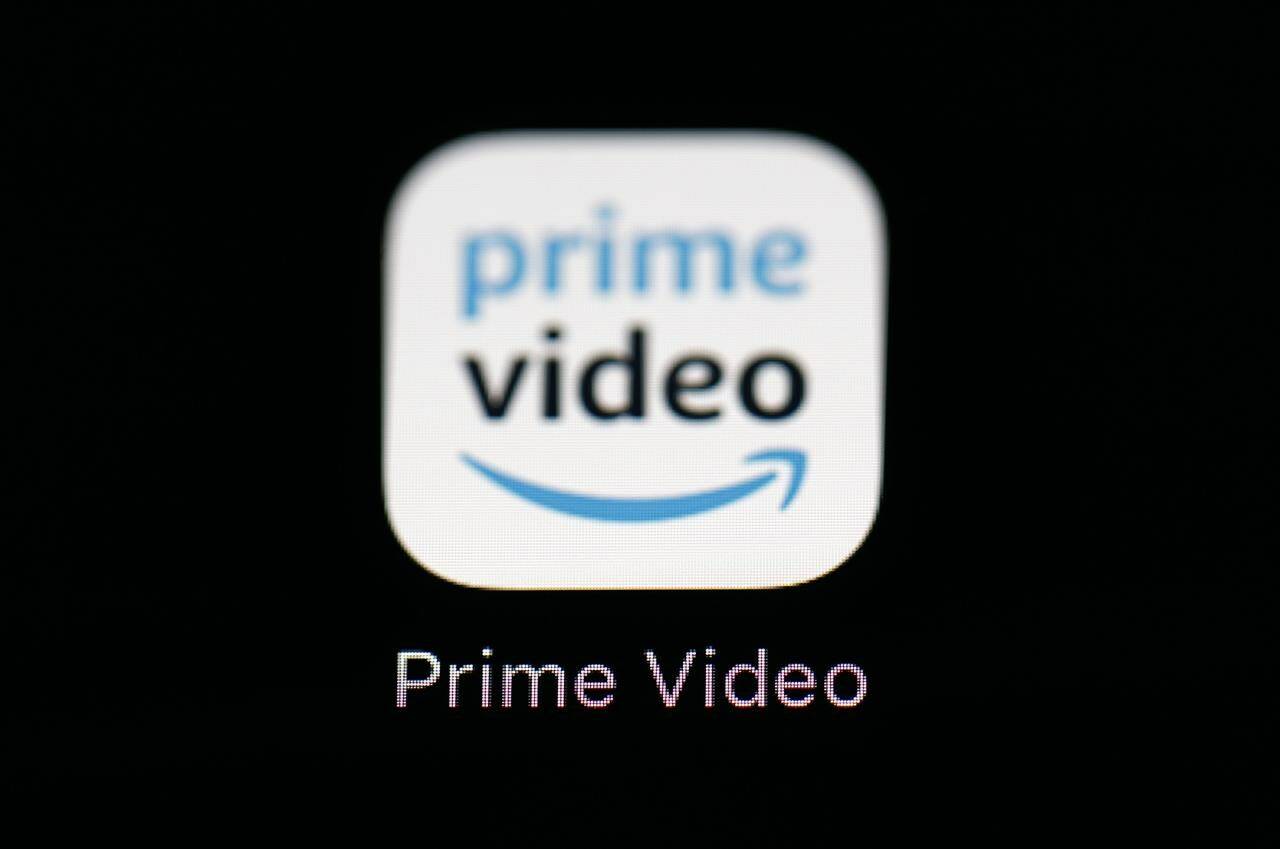 FILE - Amazon’s Prime Video streaming app on an iPad is seen in Baltimore on March 19, 2018. Amazon says that it will now start charging $2.99 per month in order for users in the U.S. to watch Prime Video ad free. (AP Photo/Patrick Semansky, File)