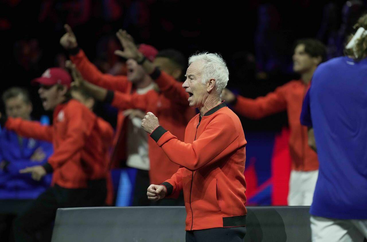 Team World’s Captain John McEnroe cheers for teammate Frances Tiafoe during his singles tennis match against Team Europe’s Stefanos Tsitsipas on the third day of the Laver Cup tennis tournament at the O2 arena in London, Sunday, Sept. 25, 2022. McEnroe is sharing his frustration over what he see as a lack of cooperation and care from tennis organization officials when it comes to the Laver Cup. THE CANADIAN PRESS/AP-Kin Cheung