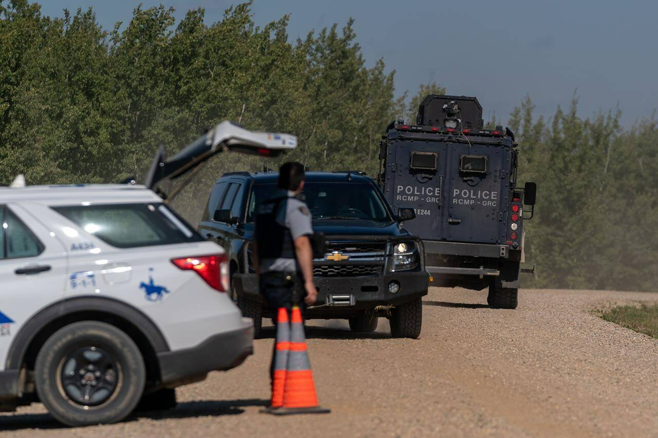 A tactical armoured RCMP vehicle drives past a police roadblock set up at James Smith Cree Nation, Sask., on Tuesday, Sept. 6, 2022. Parole Board of Canada employees were fearful of threats after it was revealed a mass killer in Saskatchewan was on statutory release at the time of last year’s rampage, newly released internal emails show. THE CANADIAN PRESS/Heywood Yu