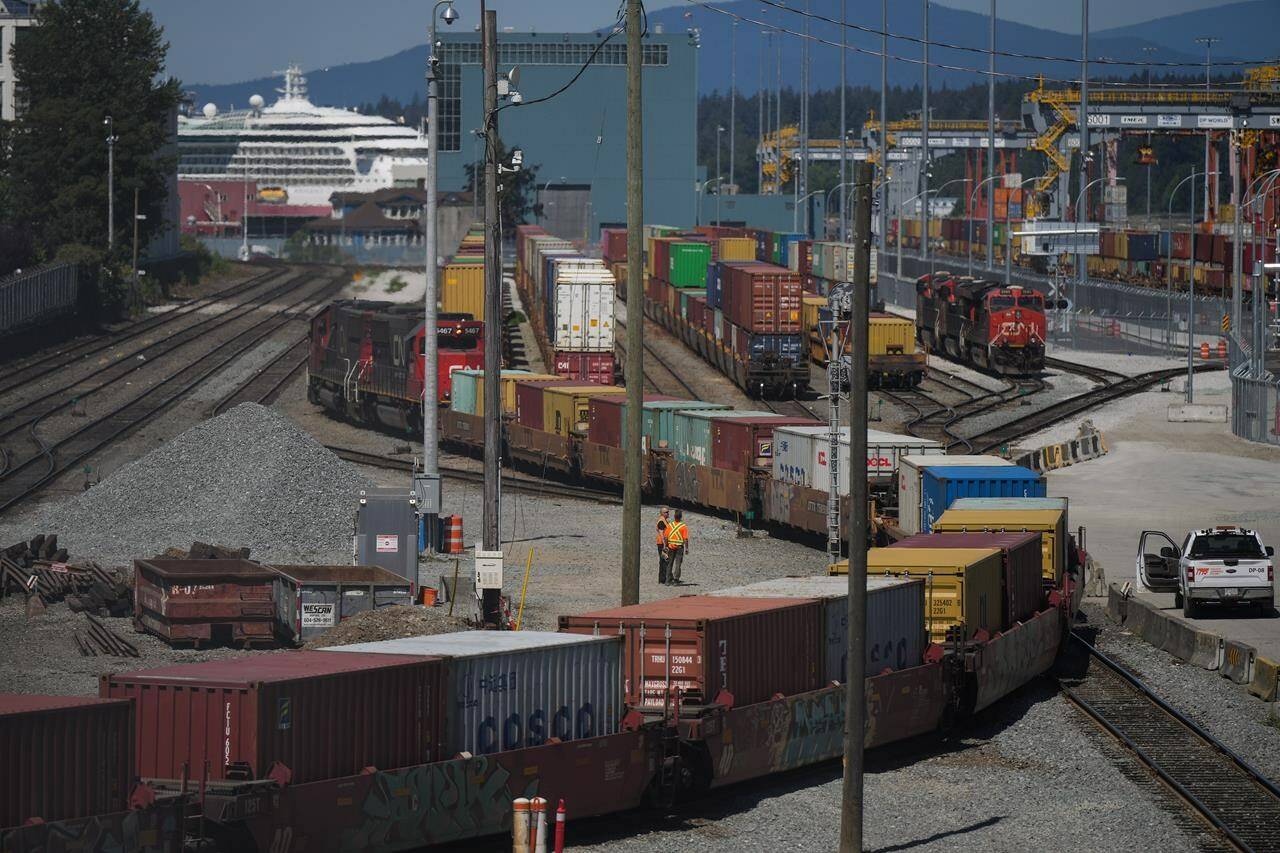 A CN Rail train moves cargo containers at the Centerm Container Terminal at port in Vancouver, on Friday, July 14, 2023.The Vancouver Fraser Port Authority says container shipments are falling fast, as consumer demand weakens amid a sputtering economy. THE CANADIAN PRESS/Darryl Dyck