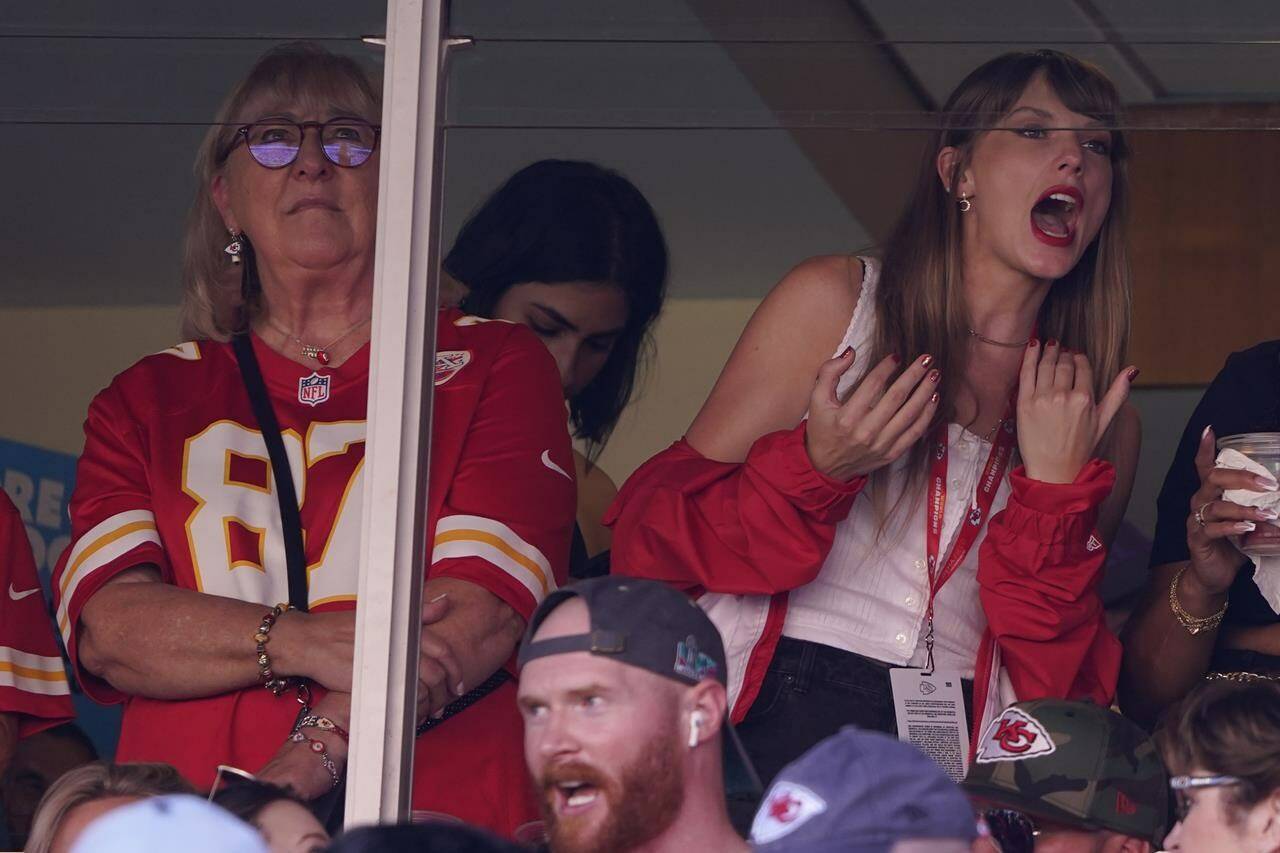 File - Taylor Swift, right, watches from a suite alongside Travis Kelce’s mother, Donna Kelce, inside Arrowhead Stadium during the first half of an NFL football game between the Chicago Bears and Kansas City Chiefs Sunday, Sept. 24, 2023, in Kansas City, Mo. Following the 12-time Grammy Award winner’s appearance at the game, jersey sales for the All-Pro tight-end seemingly skyrocketed. (AP Photo/Ed Zurga, File)
