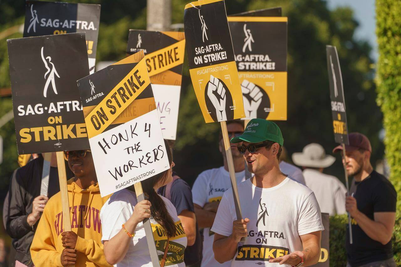 SAG- AFTRA actors rally outside the Paramount Pictures Studio in Los Angeles, Tuesday, Sept. 26, 2023. (AP Photo/Damian Dovarganes)