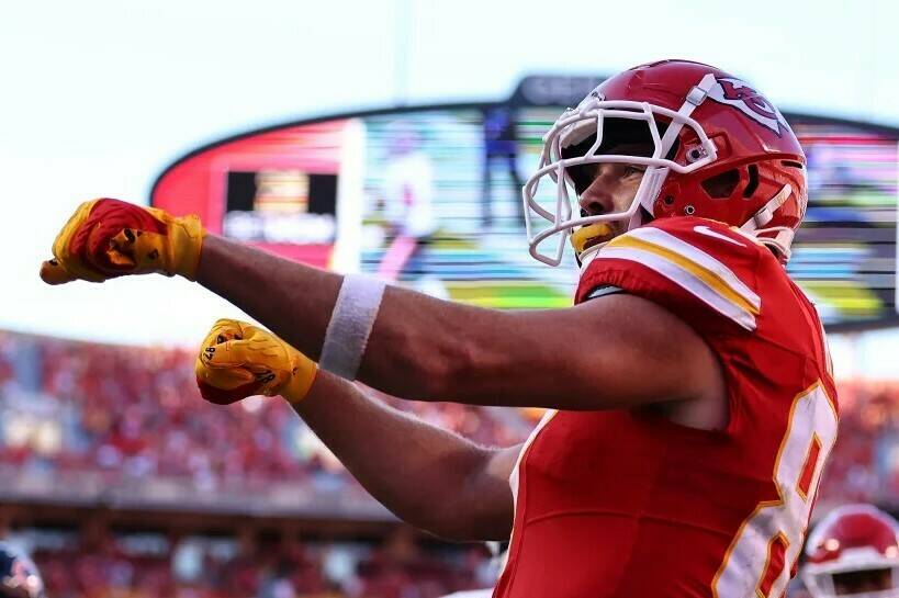 Kansas City Chiefs tight end Travis Kelce celebrates a touchdown during a 41-10 win over the Chicago Bears this past Sunday. Kelce’s fledgling romance with pop superstar Taylor Swift has ‘Swifties’ becoming fans of Kelce and the Chiefs. Andrew Mather, Kansas City Chiefs