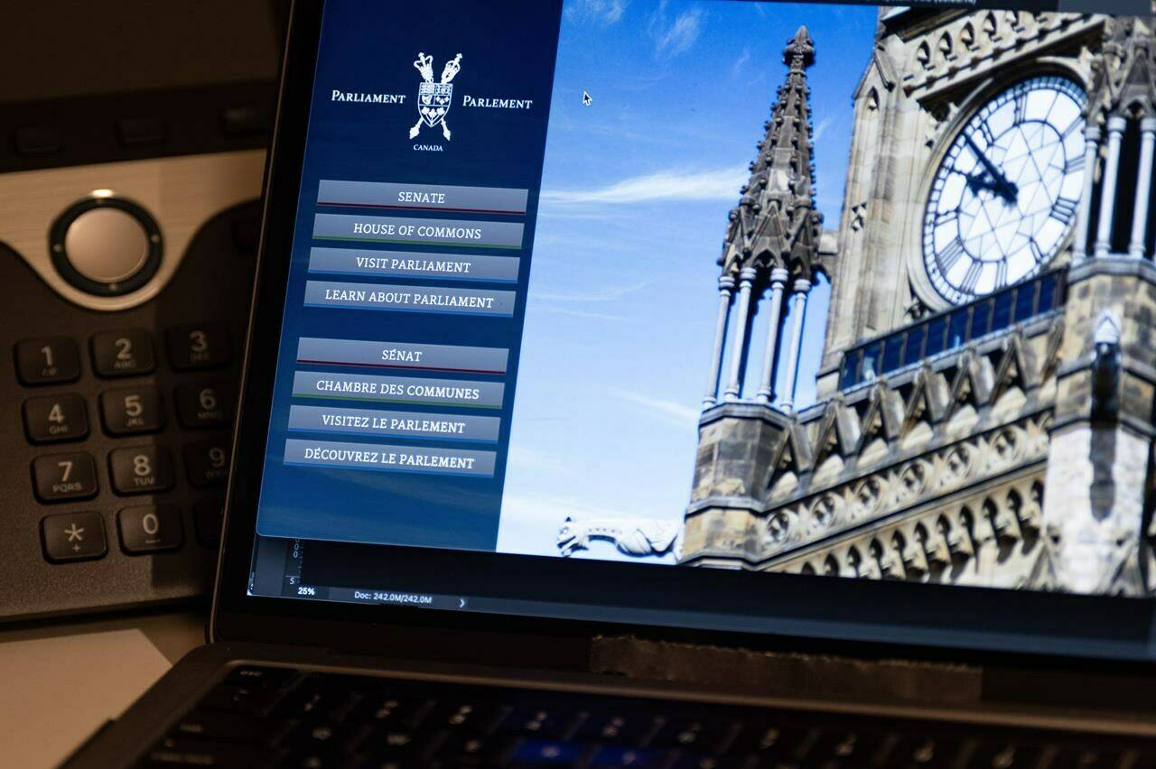 The Canadian Parliament webpage is seen on a laptop , Thursday, Sept. 28, 2023 in Ottawa. The federal government is coping with apparent cyberattacks this week, as a hacker group in India claims it has sowed chaos in Ottawa. THE CANADIAN PRESS/Adrian Wyld