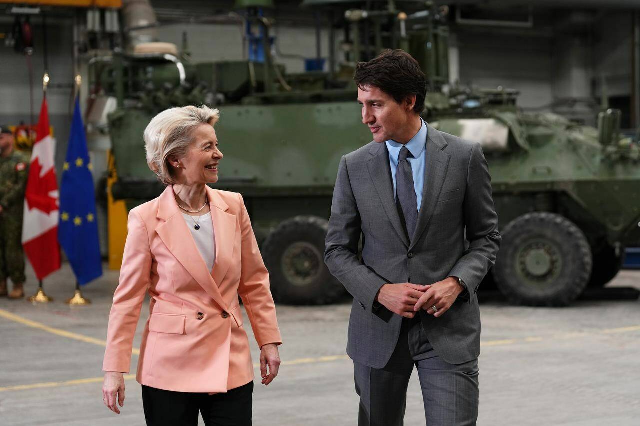 Prime Minister Justin Trudeau and European Commission President Ursula von der Leyen chat during a visit with members of the Canadian Armed Forces at CFB Kingston in Kingston, Ont., Tuesday, March 7, 2023. The top heads of the European Union are expected to visit Canada this year, as officials discuss the possibility of Ottawa joining a major research-funding pact. THE CANADIAN PRESS/Sean Kilpatrick