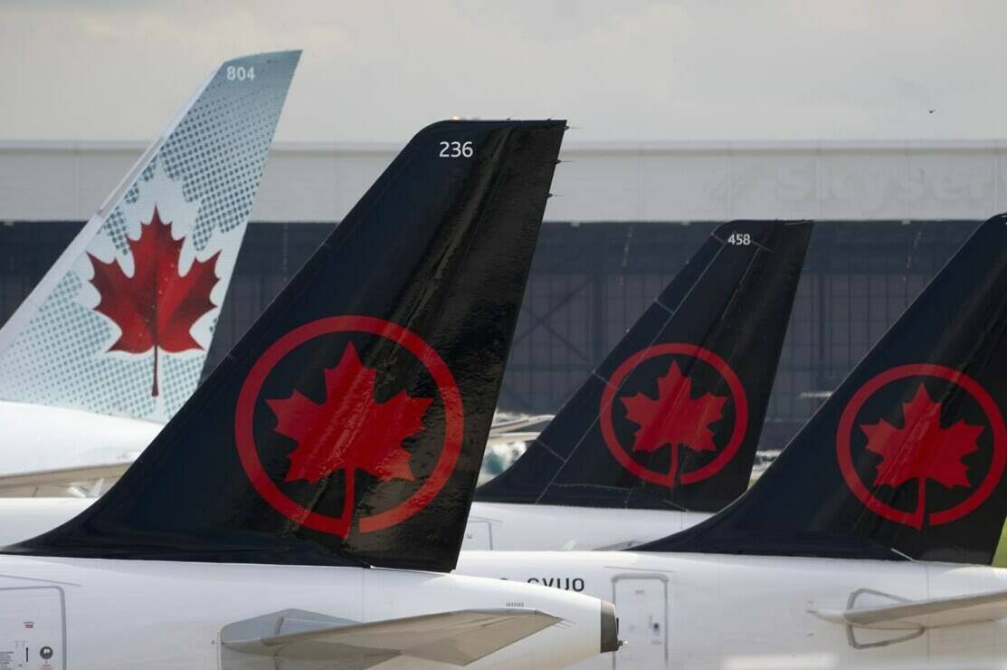 Air Canada pilots are demonstrating at Toronto’s Pearson airport today, calling for better wages and working conditions as talks with the country’s biggest airline continue. Air Canada logos are seen on the tails of planes at the airport in Montreal, Que., Monday, June 26, 2023. THE CANADIAN PRESS/Adrian Wyld