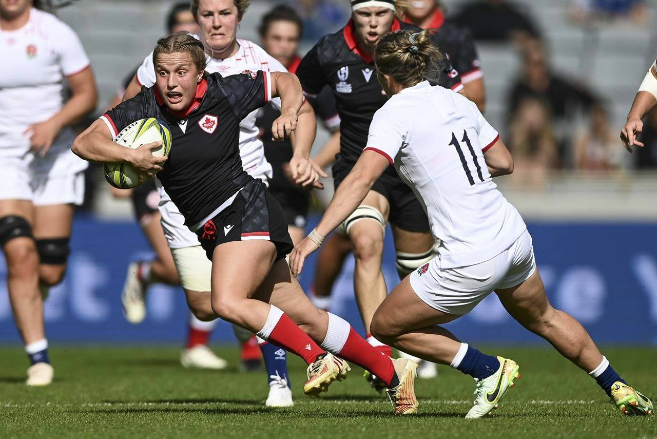 Justine Pelletier, of Canada, runs with the ball during the women’s rugby World Cup semifinal between Canada and England at Eden Park in Auckland, New Zealand, Saturday, Nov.5, 2022. Canada coach Kevin Rouet has named his roster for the new WXV women’s rugby tournament, choosing 21 players from the squad that finished fourth at the World Cup last November.THE CANADIAN PRESS/AP-Andrew Cornaga/Photosport via AP