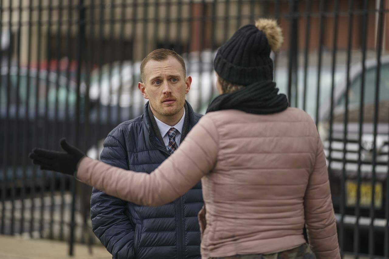 Josh Kruger, left, then the Communications Director, the Office of Homeless Services at City of Philadelphia, at a tent encampment in Philadelphia, on Jan. 6, 2020. The journalist and advocate who rose from homelessness and addiction to serve as a spokesperson for Philadelphia’s most vulnerable was shot and killed at his home early Monday, Oct. 2, 2023 police said. (Jessica Griffin/The Philadelphia Inquirer via AP)