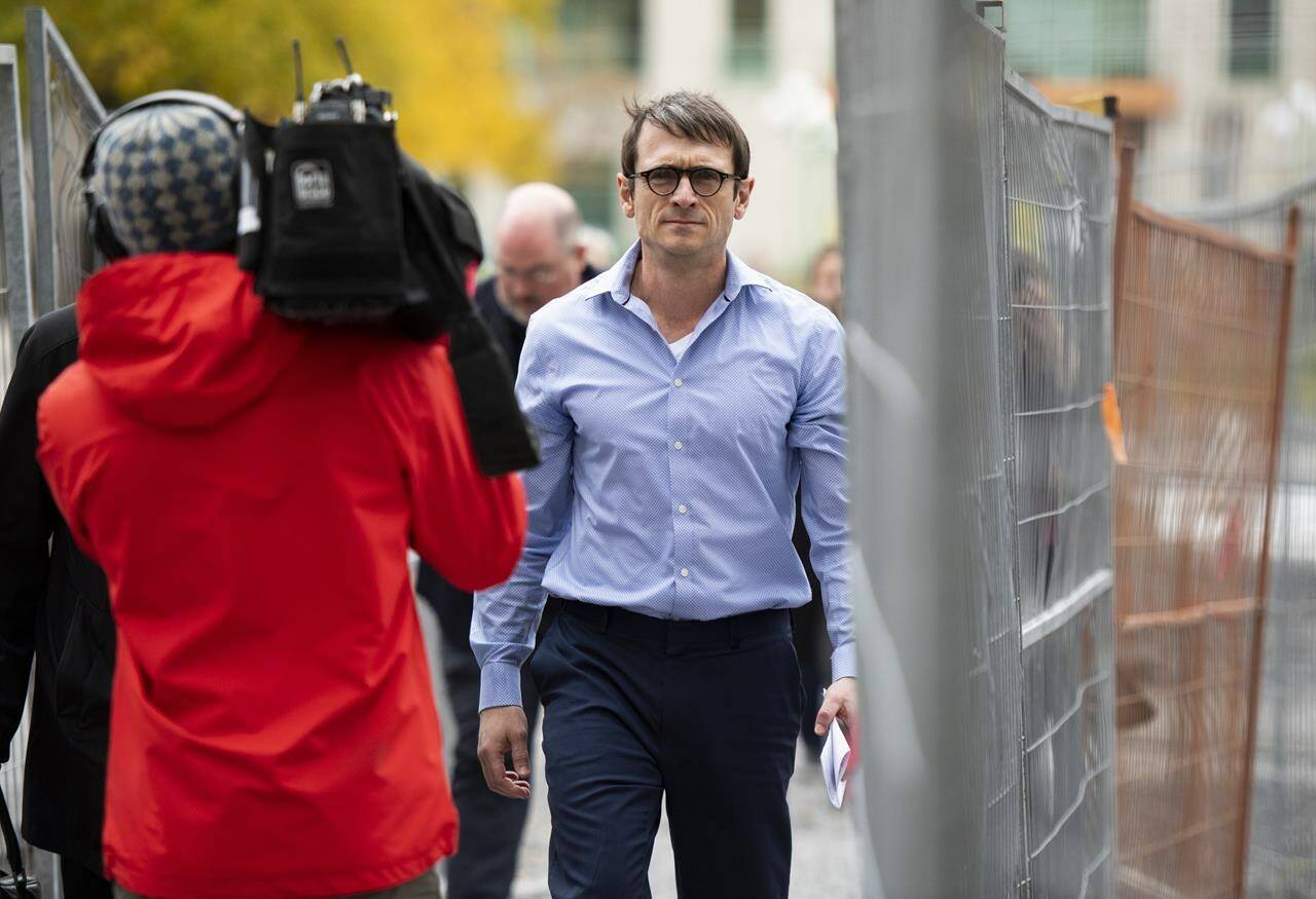 Cameron Ortis, a senior intelligence official at the RCMP, walks with his lawyer Ian Carter, obscured at left, after leaving the courthouse in Ottawa after being granted bail on October 22, 2019. More than four years after Cameron Jay Ortis was charged with breaching Canada’s secrets law, the former RCMP intelligence director is about to get his day in court. Ortis was taken into custody in Ottawa on Sept. 12, 2019, an arrest that deeply shocked the national police force. As the head of the RCMP’s National Intelligence Co-ordination Centre, Ortis had access to some of the country’s most closely held information. Ortis, 51, is charged with violating the Security of Information Act by allegedly revealing secrets to three individuals and trying to do so in a fourth instance, as well as breach of trust and a computer-related offence. THE CANADIAN PRESS/Justin Tang