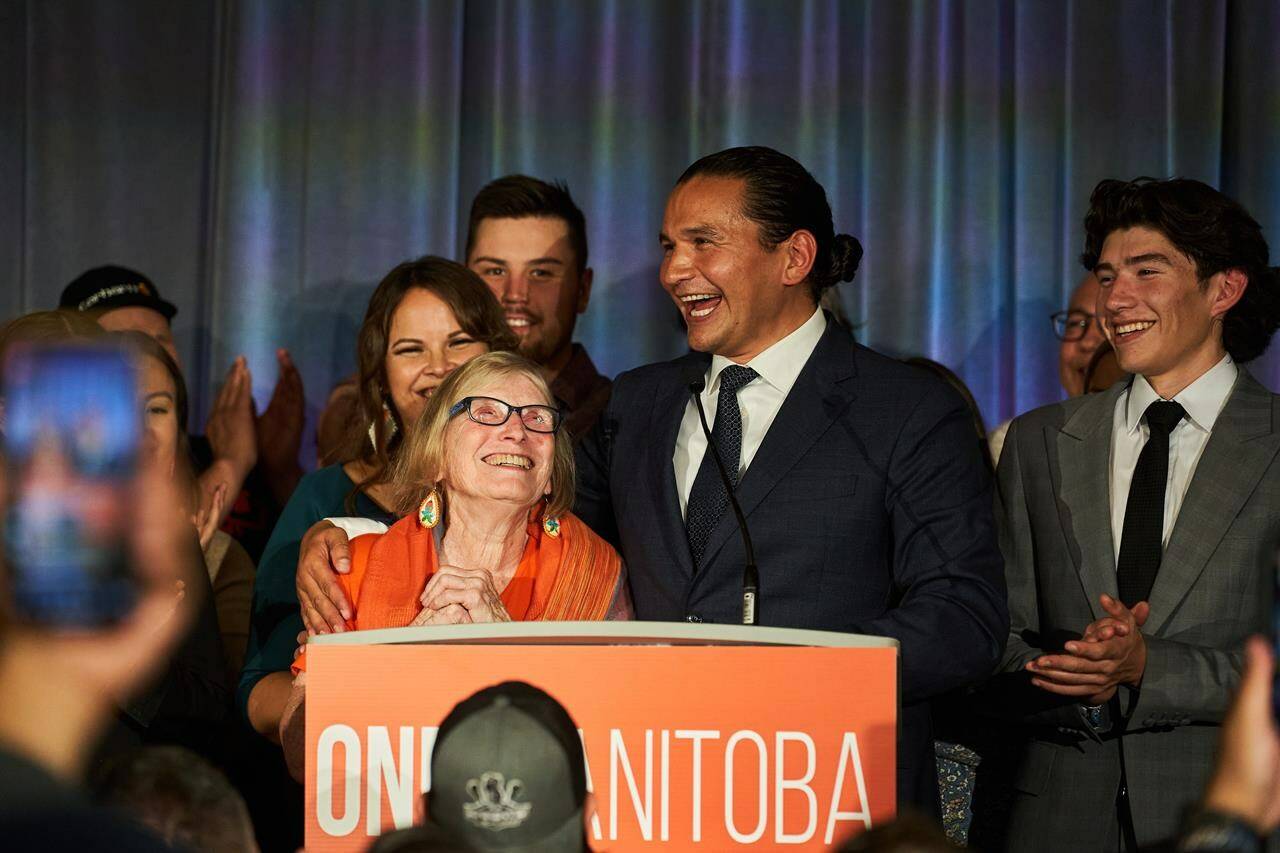 Manitoba NDP Leader Wab Kinew delivers his victory speech and wishes his mother, Kathi Avery Kinew, a happy birthday, after winning the Manitoba provincial election in Winnipeg, Tuesday, Oct. 3, 2023. THE CANADIAN PRESS/David Lipnowski