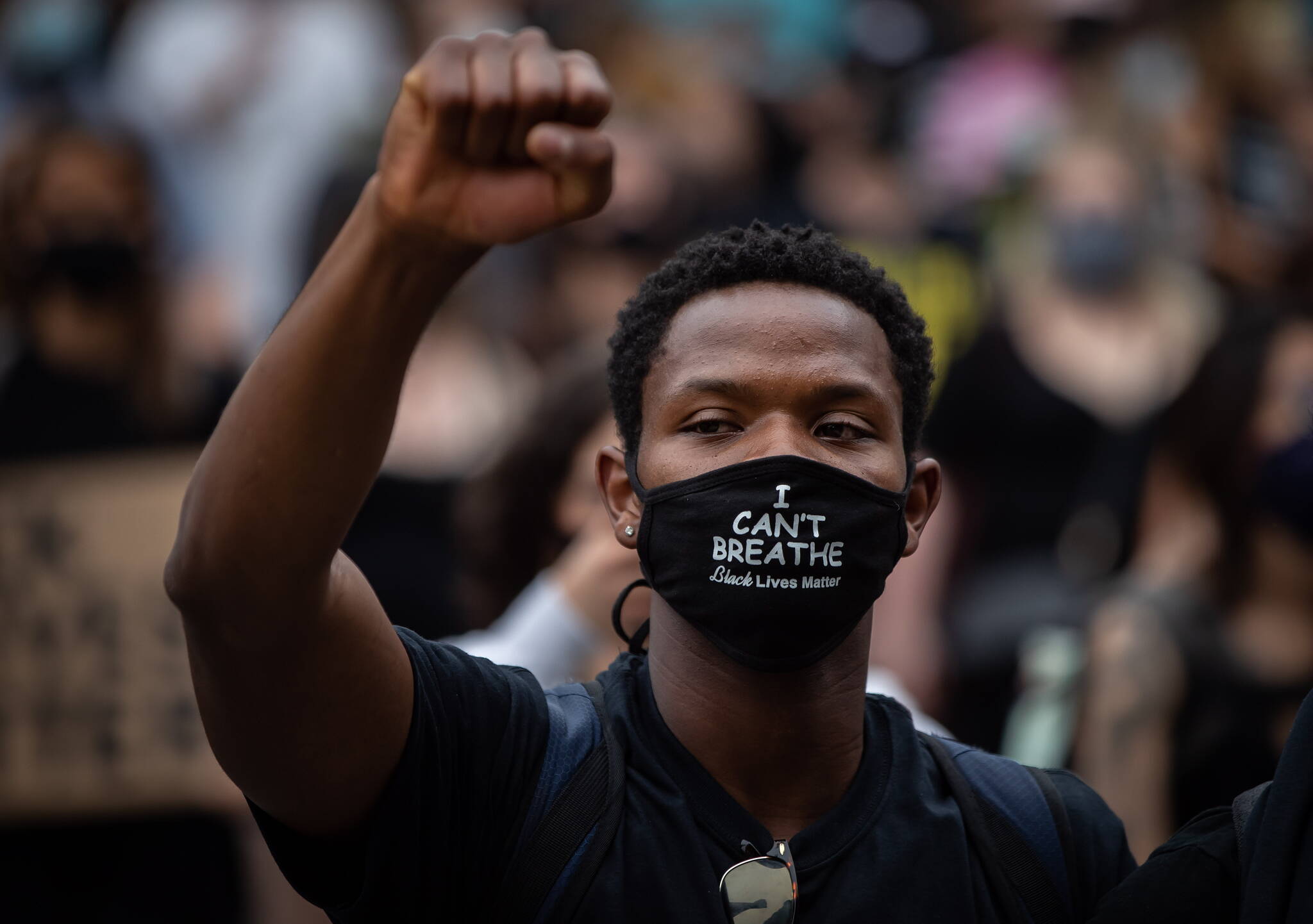 A man wears a face mask that says “I Can’t Breathe” in Vancouver on June 19, 2020 during the height of the Black Lives Matter protests. B.C. police reforms that began in 2020 have been delayed by the public safety ministry. Photo: Darryl Dyck/The Canadian Press