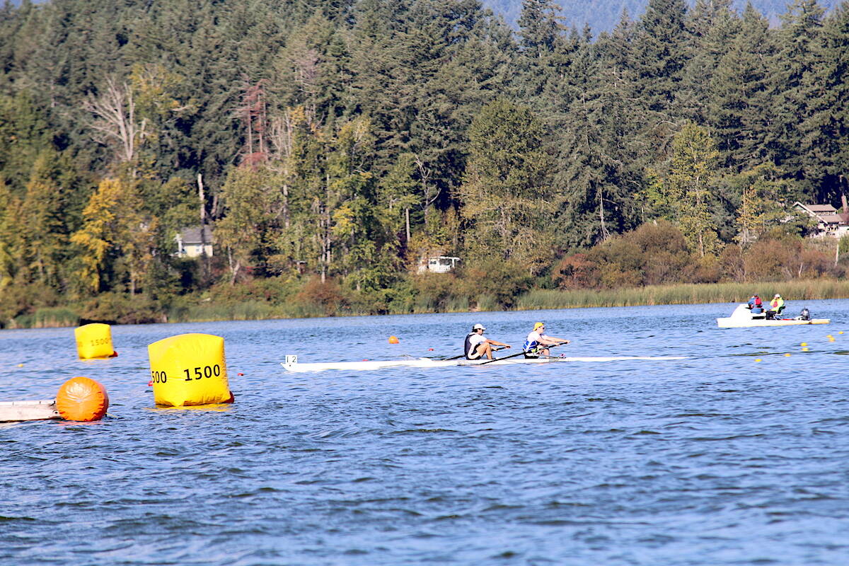 Rowers near the 1500m mark in a men’s pair qualifying race on Friday morning on Quamichan Lake during the 2023 Canadian National Rowing Championships. (Sarah Simpson/Citizen)
