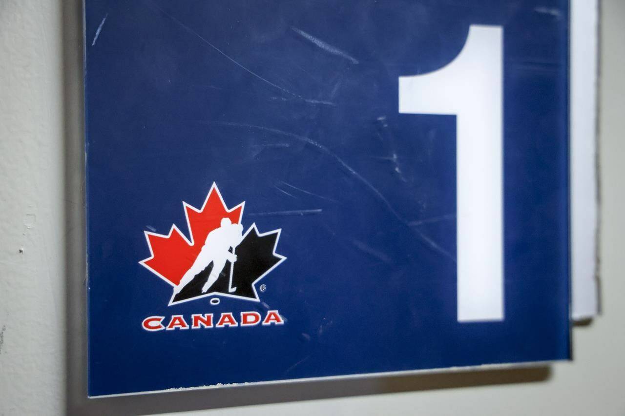 A Hockey Canada logo is seen on the door to a dressing room the organizations home rink in Calgary, Alta., Sunday, Nov. 6, 2022. Hockey Canada has implemented a new dressing room policy for the 2023-24 minor hockey season, including a “minimum attire rule,” with the goal of respecting privacy and making dressing environments more inclusive. THE CANADIAN PRESS/Jeff McIntosh