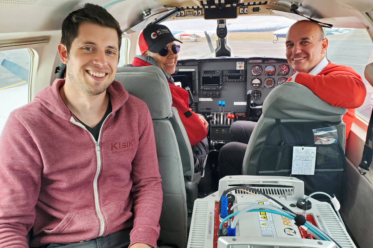 Corey Newton, left, and Robyn Stewart of Kîsik GeoSpatial & Aerial Survey Company and Minister of Water, Lands and Resource Stewardship Nathan Cullen in Williams Lake Thursday, Oct. 5. (Monica Lamb-Yorski photo - Williams Lake Tribune)
