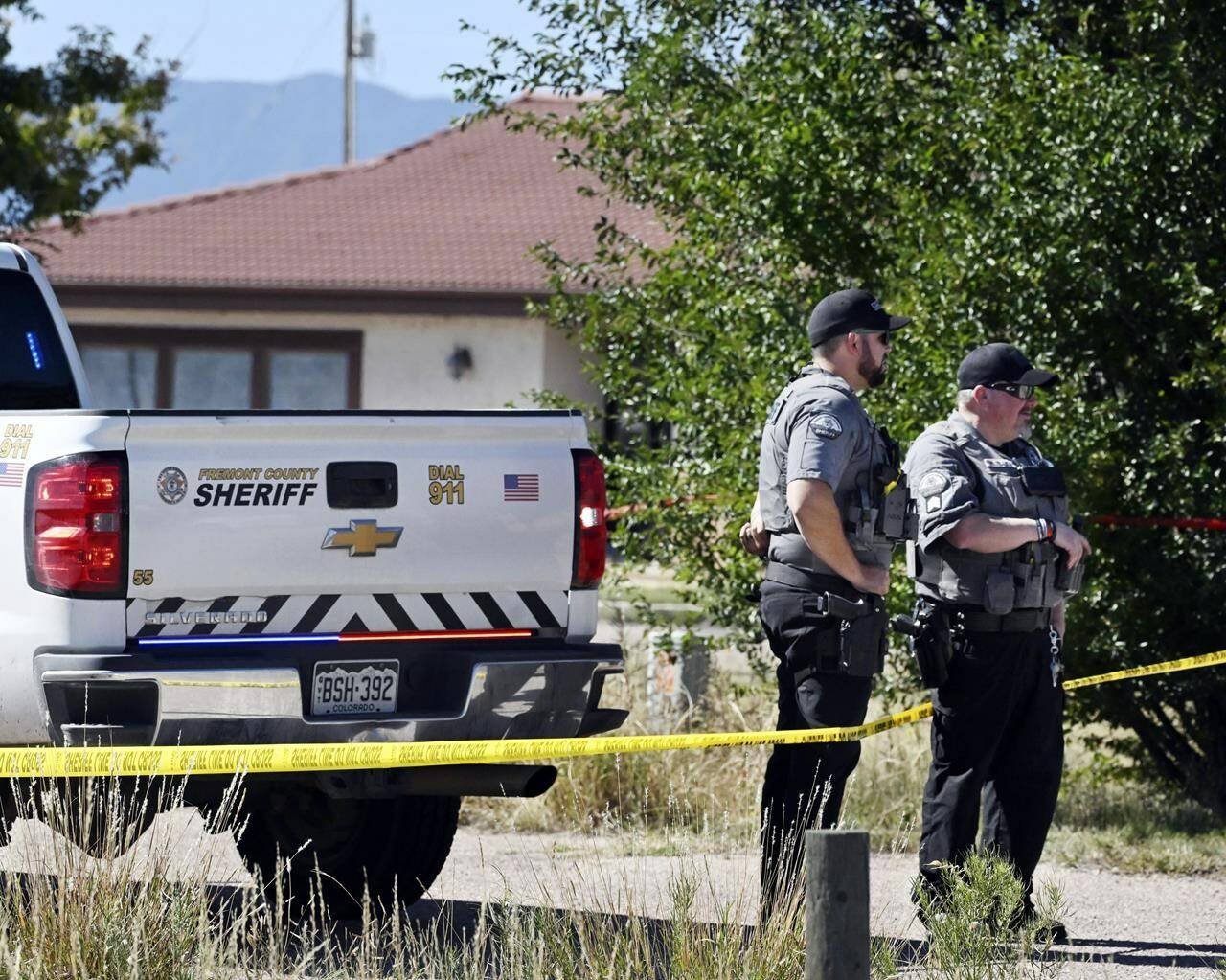 Fremont County deputies guard the road leading to the Return to Nature Funeral Home in Penrose, Colo. Thursday, Oct. 5, 2023. Authorities said Thursday they were investigating the improper storage of human remains at a southern Colorado funeral home that performs “green” burials without embalming chemicals or metal caskets. (Jerilee Bennett/The Gazette via AP)