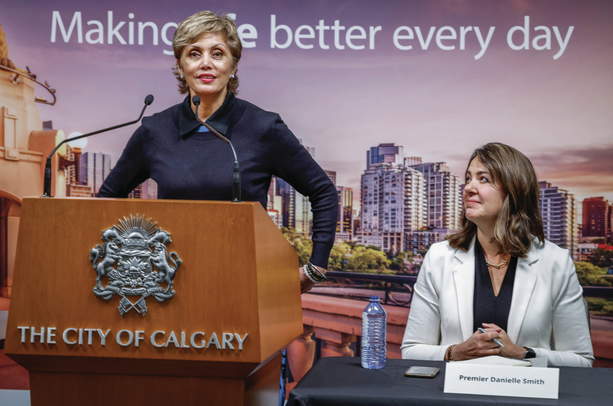 Alberta Premier Danielle Smith, left, looks on as City of Calgary mayor Jyoti Gondek, announces the signing of agreements on the new NHL arena deal in Calgary, Alta., Thursday, Oct. 5, 2023.THE CANADIAN PRESS/Jeff McIntosh