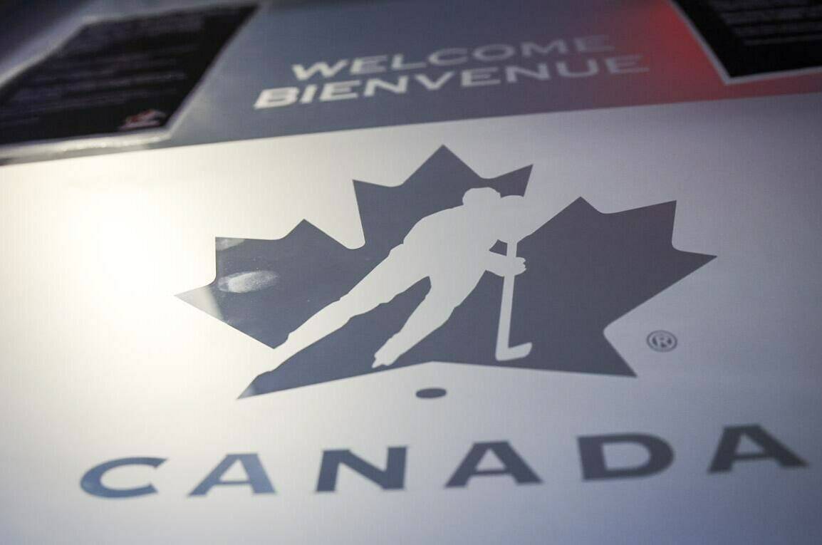 A Hockey Canada logo is seen on the door to the organizations head office in Calgary, Alta., Sunday, Nov. 6, 2022.THE CANADIAN PRESS/Jeff McIntosh